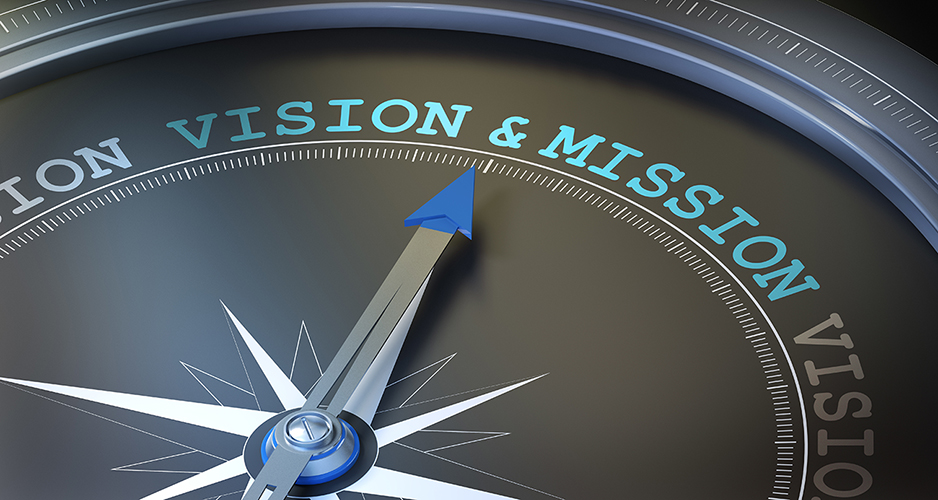 A compass needle pointing to the words Vision and Mission